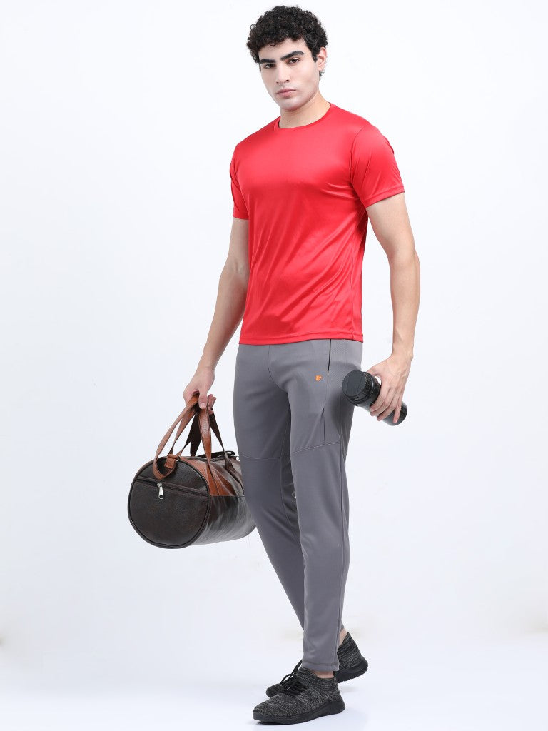 Model wearing IBX men’s dry fit track pants – styled for active urban comfort and performance - Gray