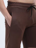 men's platted casual shorts brown close-up fabric texture shop online - Brown